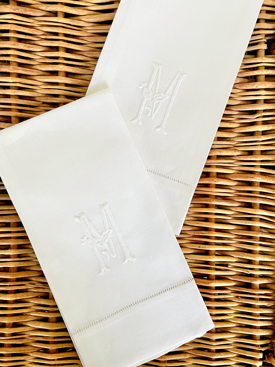 pair of embroidered “M” hand towels