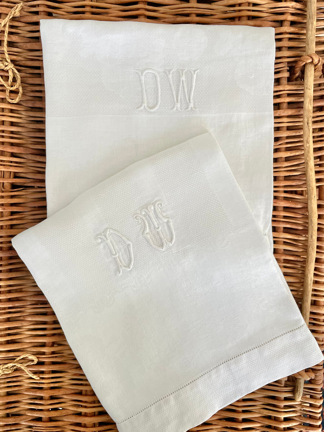 pair of embroidered “DW” linens